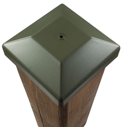 Green 4x4 post cap fastened to a wood fence post