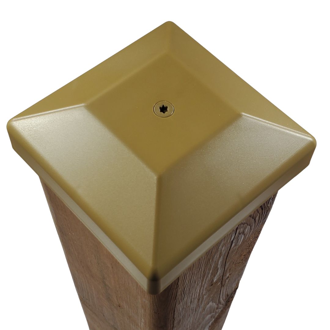 Tan 4x4 post cap fastened to a wood fence post